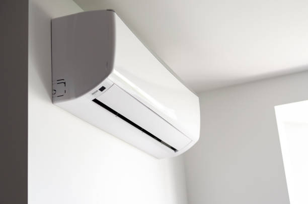 istock Climate control. White air conditioner on a white wall. Global warming. 2162838332