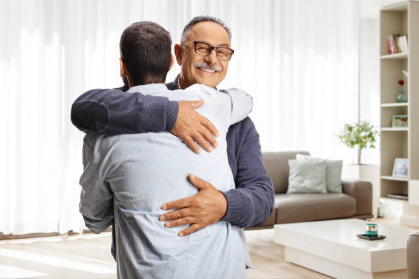 istock Happy men greeting each other with a hug 2162838614
