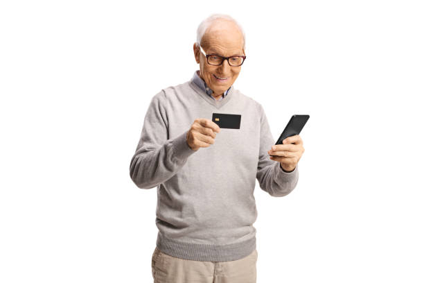 istock Elderly man using a credit card for online payment with a mobile phone 2162838619