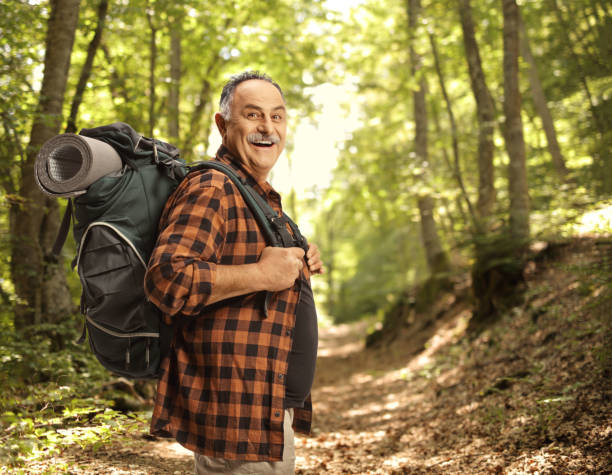 istock Cheerful mature hiker with a backpack smiling 2162838636