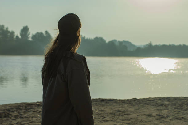 istock Male silhouette against sunset background. 2162840863