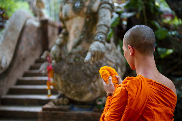 istock Thai Buddhism monk making offering at the temple 2162841580
