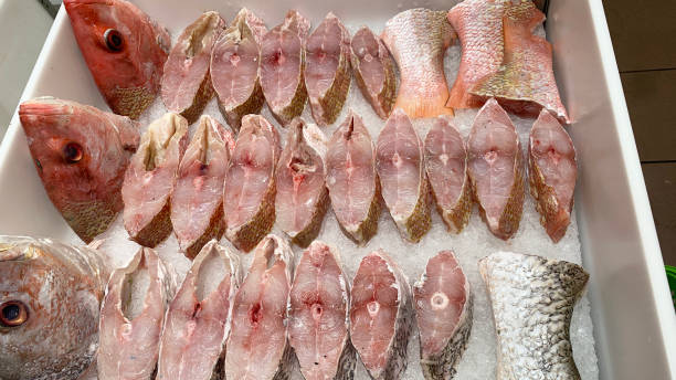 Slices of red snapper fish displayed in supermarket. Fresh seafood concept Slices of red snapper fish displayed in supermarket. Fresh seafood concept. salmon and red snapper stock pictures, royalty-free photos & images