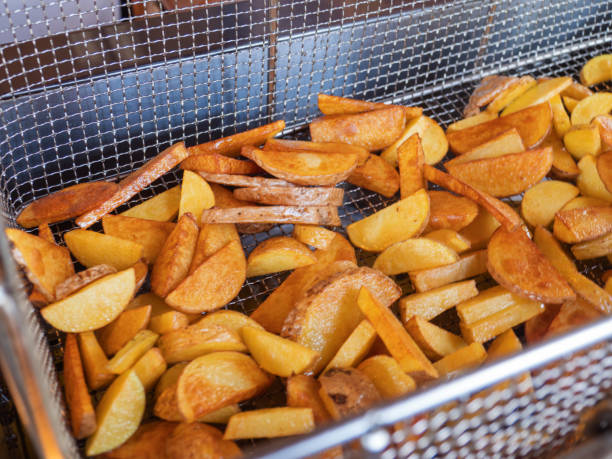 istock Crispy Golden Fried Potato Wedges in Basket 2162845330
