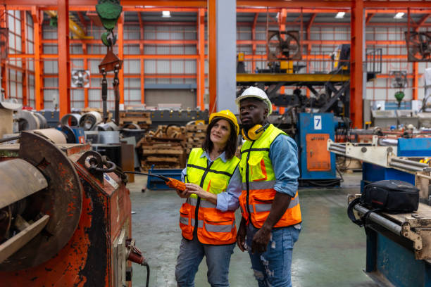 istock Two inspectors checking in a factory 2162846726