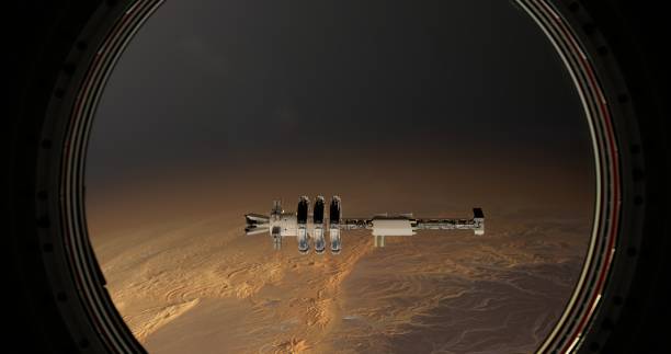 istock Through the porthole, the space station is visible as it hovers over a desert planet 2162849323