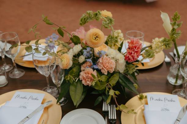 istock Beautifully arranged wedding table setup with floral centerpiece and elegant tableware 2162849616