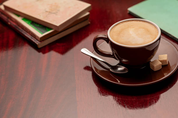 istock Cup of coffee on a wooden table. 2162849800