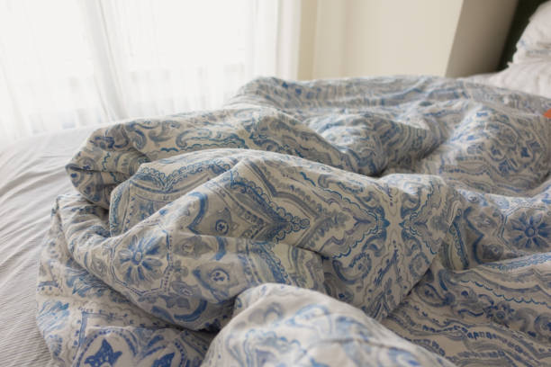 istock messy bed in early morning , messy bed after waking up 2162850763