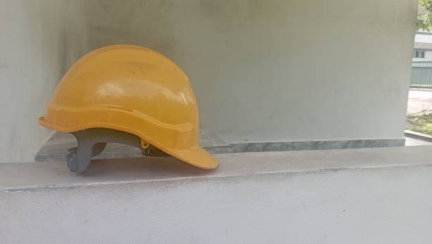 istock Yellow workers' helmets are used in many workplaces such as construction, retail, and others. 2162851983