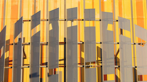 istock The concrete building is painted in yellow pattern and is equipped with decorative metal plates. 2162852625