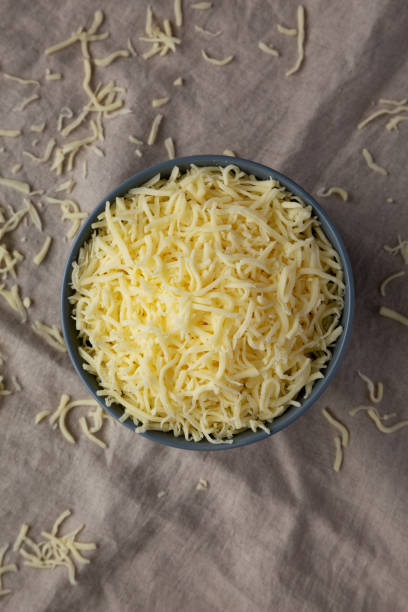 istock Shredded Mozzarella Cheese in a Bowl, top view. Flat lay, overhead, from above. 2162852728