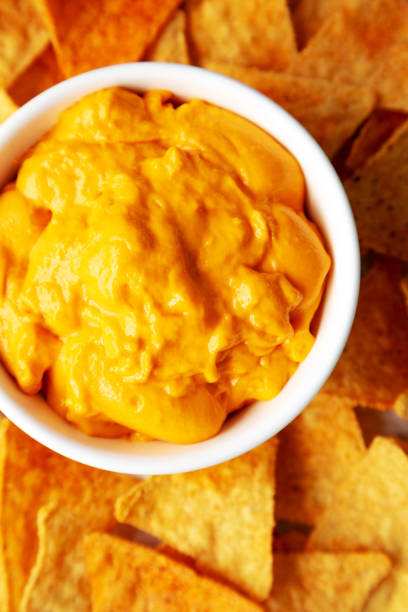 istock Cheese dip with tortilla chips, top view. Flat lay, overhead, from above. Close-up. 2162853029