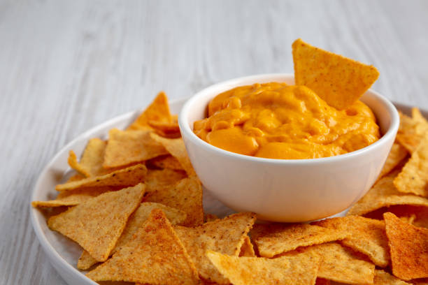 istock Cheese dip with tortilla chips, side view. Close-up. 2162853055