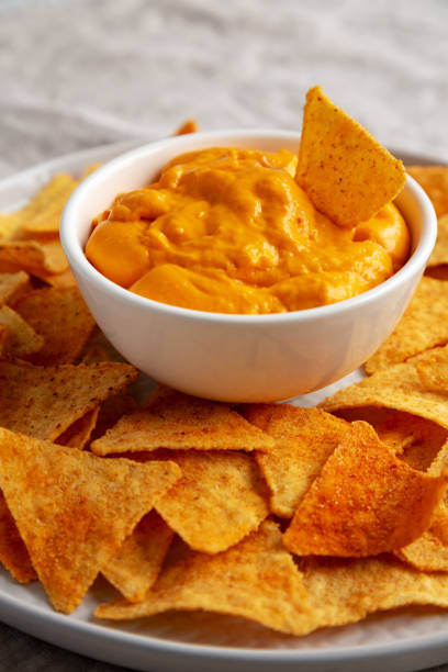 istock Cheese dip with tortilla chips, side view. Close-up. 2162853063