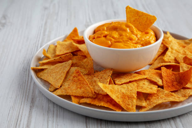 istock Cheese dip with tortilla chips, side view. Close-up. 2162853066