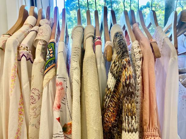 Woman’s Clothing Fabric on Hangers stock photo