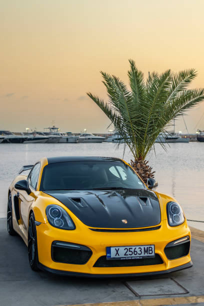 Seville, Spain - 23 January, 2025: A yellow Porsche 997 GT2 in a city street