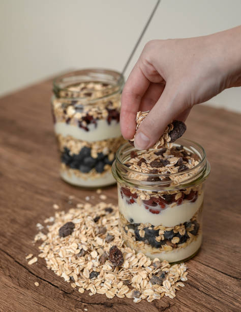 istock Preparing lunch for work, nutritious layered oatmeal in a jar 2162860096