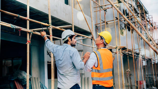 istock Engineers or leader discussion and pointing to construction site. 2162860367