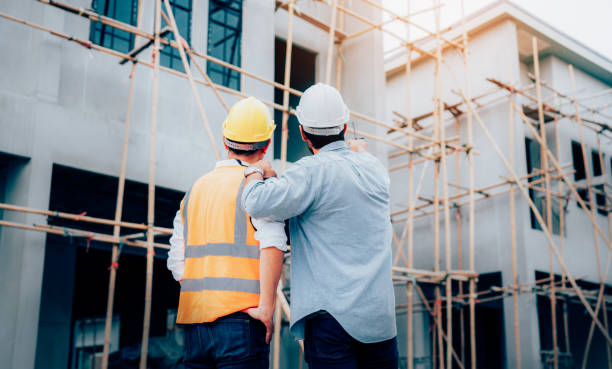 istock Engineers or leader discussion and pointing to construction site. 2162860463