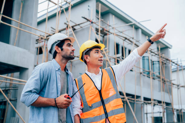 istock Engineers or leader discussion and pointing to construction site. 2162860464