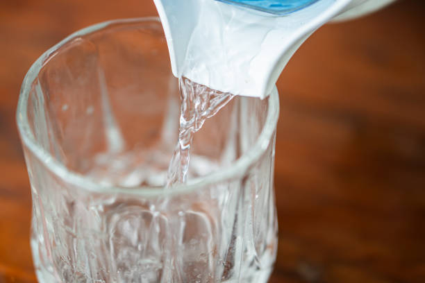 istock Pouring Water into a Glass 2162861210