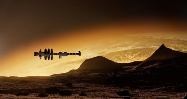 A spaceship hovers over golden-lit mountains beneath an orange sky