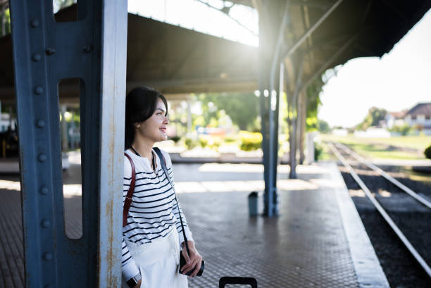 istock female traveler waiting the train 2162862997