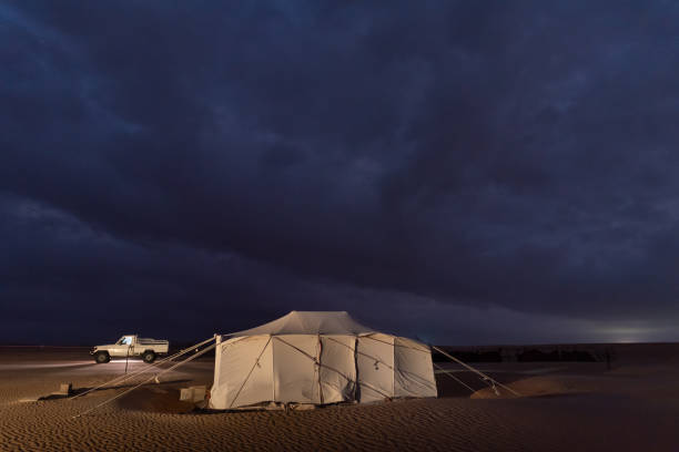 istock Dark storm clouds in the desert camel farm. 2162863335
