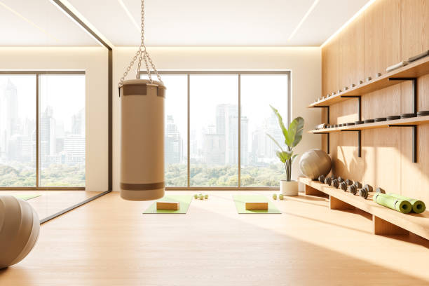 istock Home sport room interior with dumbbell shelf and punching bag, panoramic window 2162868075