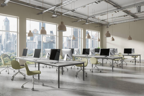 istock Modern office with computer workstations, minimalist design, large windows, cityscape view, contemporary workspace concept.  3D Rendering 2162868138