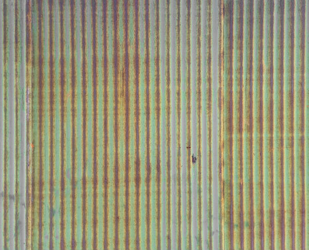 artistic of green old and rusty zinc metal sheet wall. industrial backdrop for design. artistic of green old and rusty zinc metal sheet wall. industrial backdrop for design. vintage style metal sheet wall texture. corrugated metal fence ideas stock pictures, royalty-free photos & images