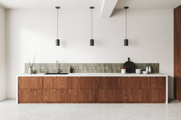 istock Modern kitchen interior with wood cabinets, pendant lights, and tile backsplash, minimalistic style, light background, stylish home design.  3D Rendering 2162868312