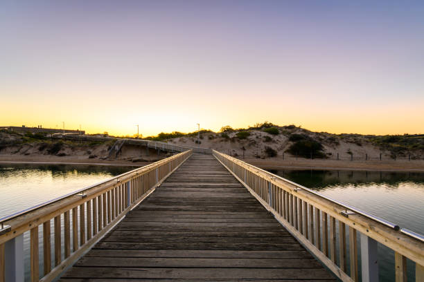 istock Southport boardwalk across the Onkaparinga river at sunset 2162868363