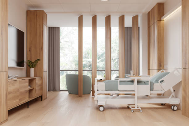 istock Modern hospital room interior with bed, tv and drawer. Panoramic window 2162868671