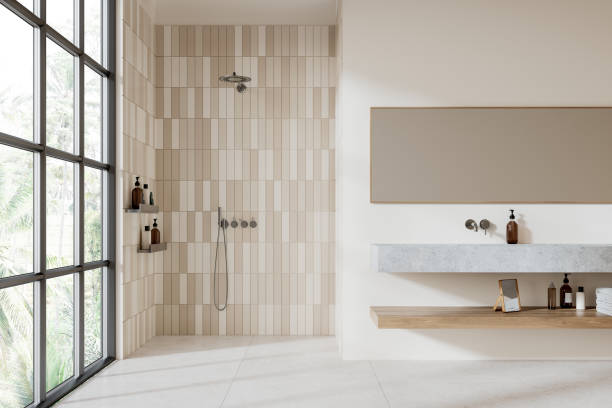 istock Elegant hotel bathroom interior with sink and shower, panoramic window 2162868700