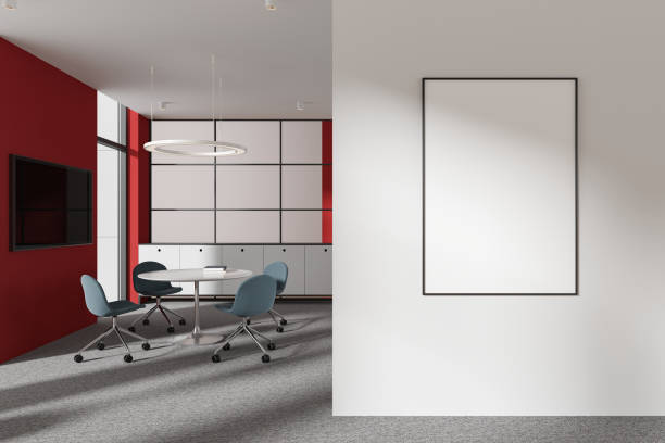 istock Modern office interior with meeting table and tv screen, window and mockup frame 2162869251