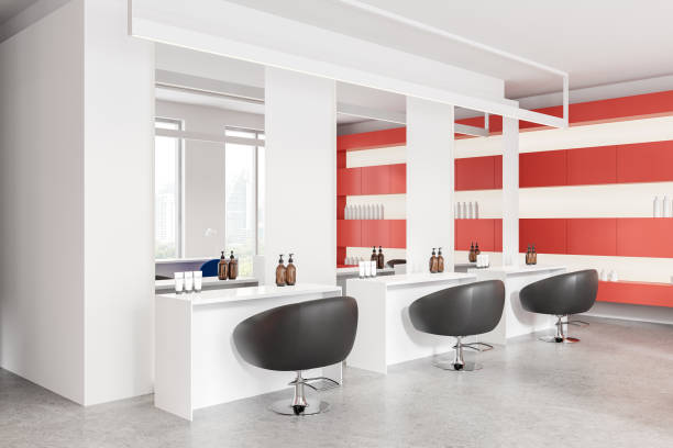 Corner view of white and red beauty salon interior, armchairs and desks in row with cosmetics and mirrors. Skin care or hairdressing studio with panoramic window on skyscrapers. 3D rendering