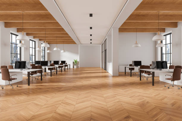 istock Office coworking interior with pc monitors on tables in row, panoramic window 2162870624