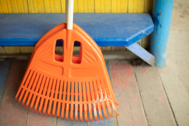 Garden tools for cleaning. Orange Tool. Cleaning on terrace. Restoring order.