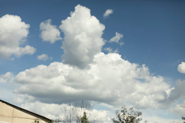 Summer clouds. White clouds in the sky. Warm weather. Heavenly landscape.