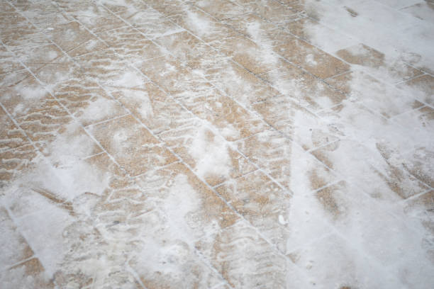 Snow on the road. Snow texture. Marked tracks. Abstract background.