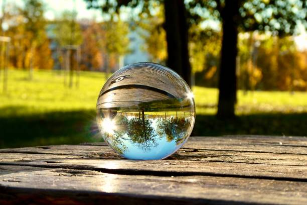 istock Crystal ball on wooden table in public park 2162873309