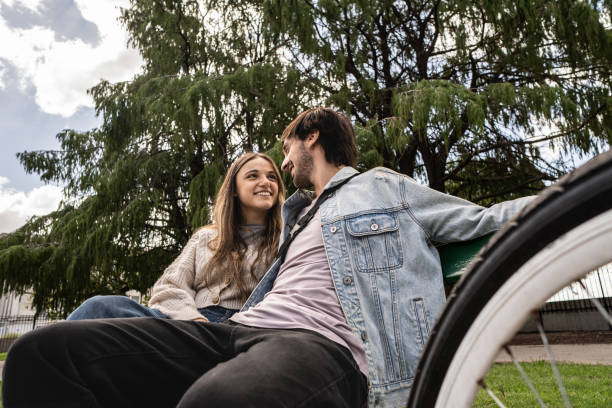 istock Young couple talking on the public park 2162873833