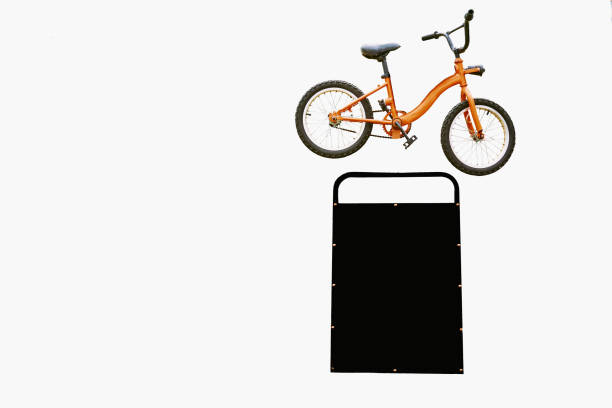 Orange bicycle, black board for inscription, information on white