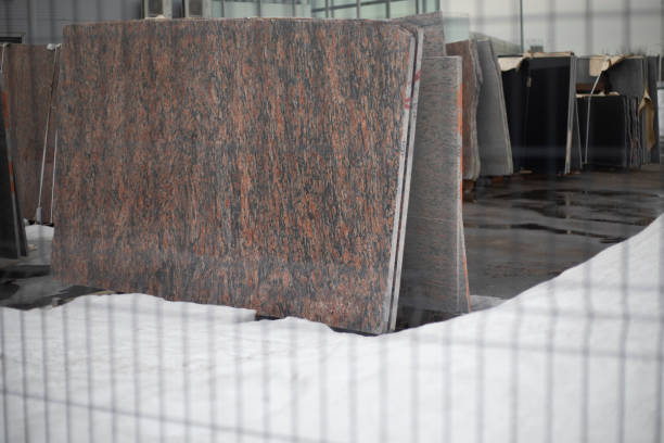 Marble slab. Build materials. Fence around a hardware store. Granite slab.
