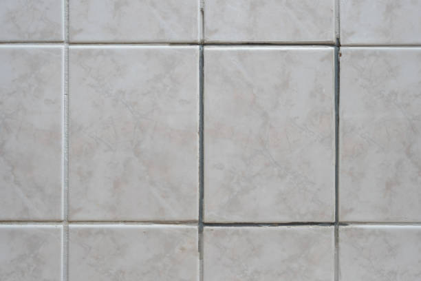 istock replaced tile on the wall in the bathroom 2162875827