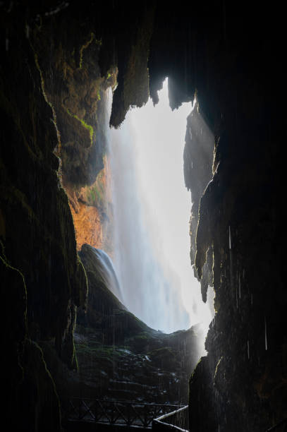 istock Inside the cave behind a waterfall in the Monasterio de Piedra, Spain. 2162876327