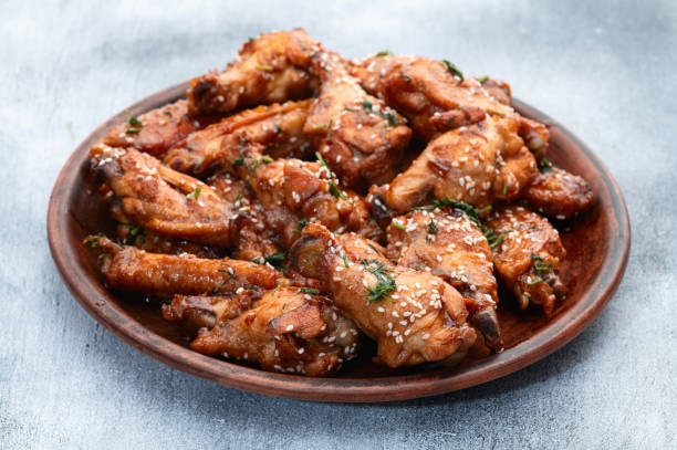 istock Caramelized in sause chicken wings  . Bar-b-q food background photo 2162876708
